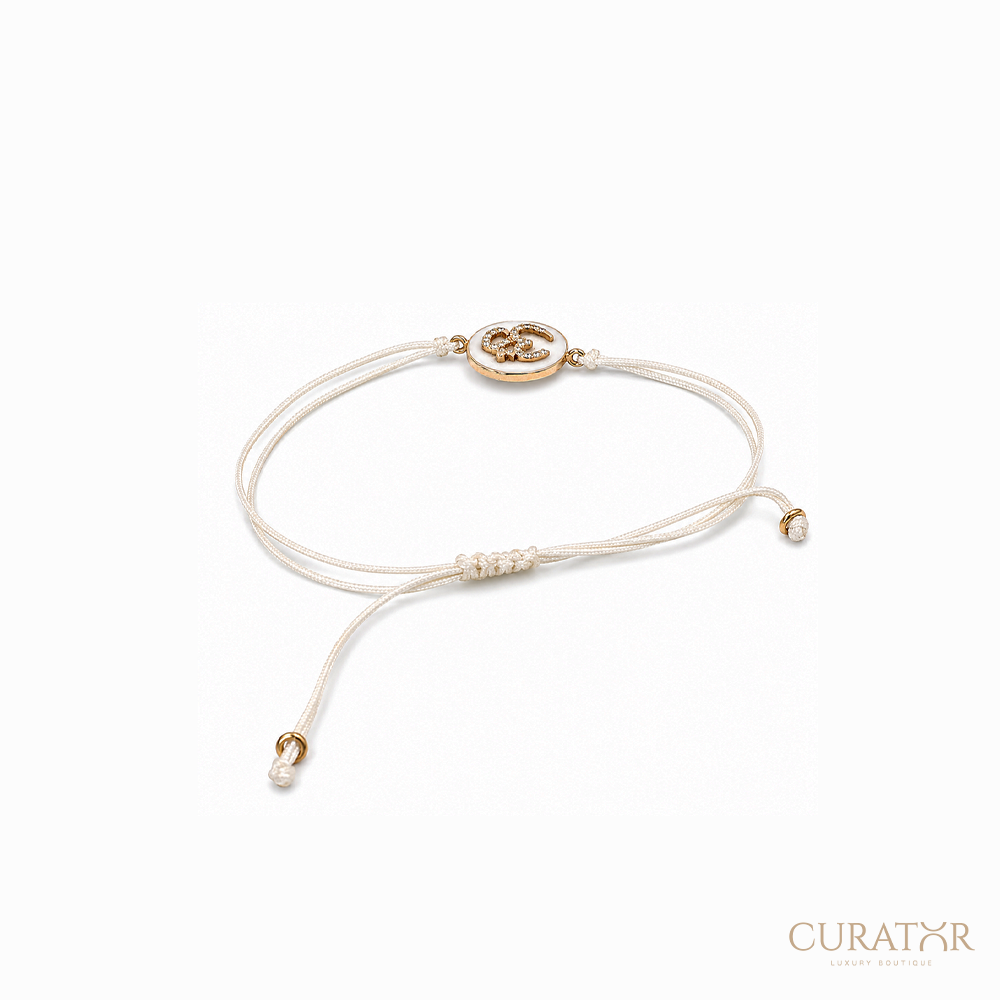 Anil Arjandas Jewels: Diamond Om Charm & Mother-of-Pearl Cream Cord Adjustable Bracelet